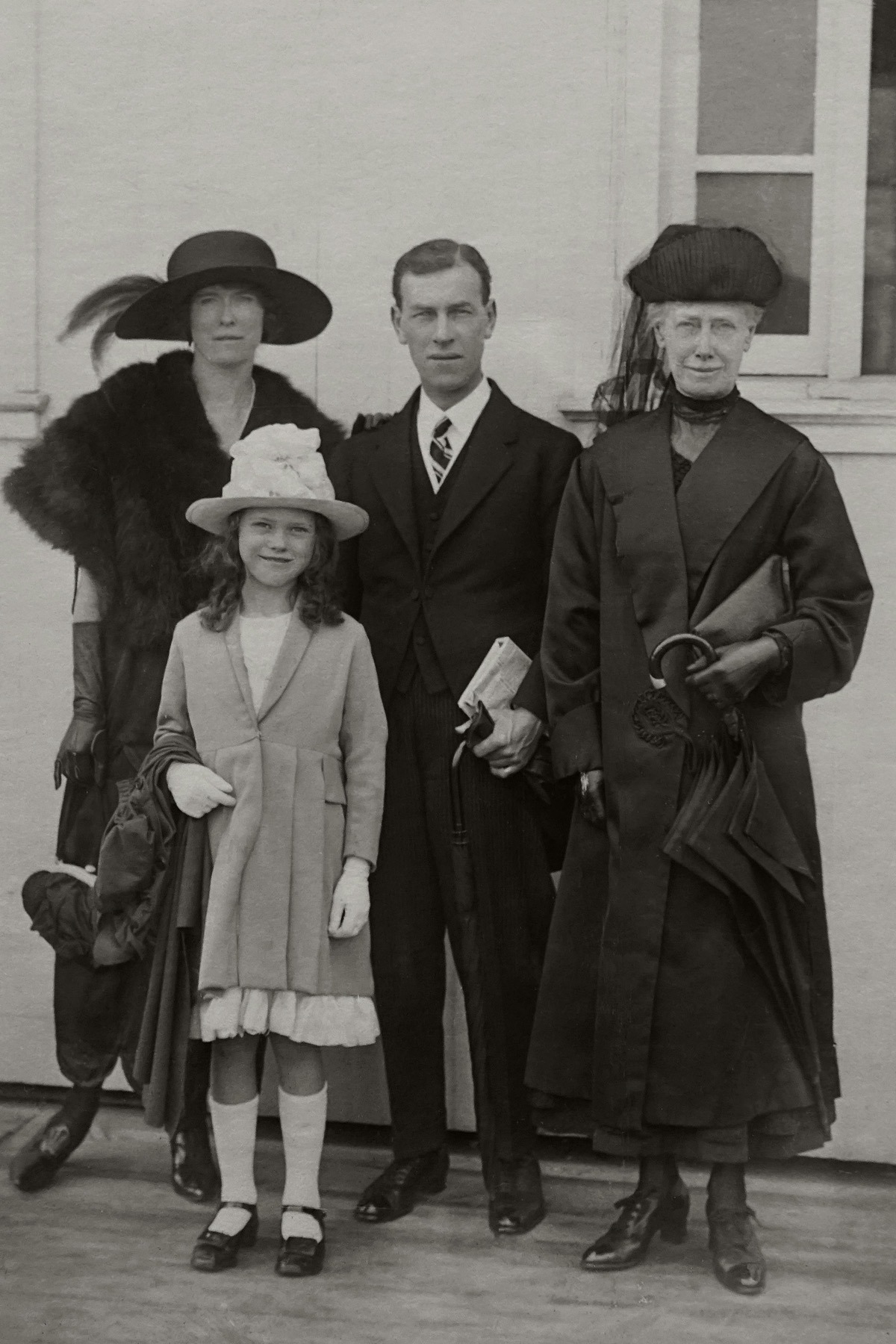 Faded vintage family portrait before restoration